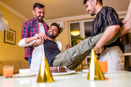 indian friends at the restaurant at Birthday home partyの写真素材