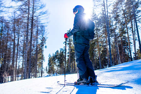 young sweden man in forest ready to drive on ski