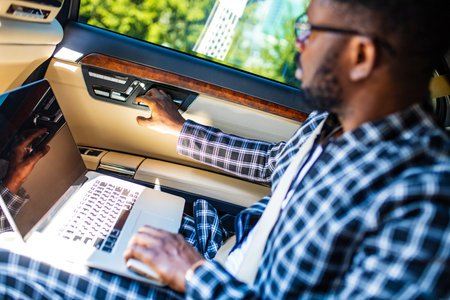 latin hispanic man in a stylish plaid suit wear glasses in luxury sports car