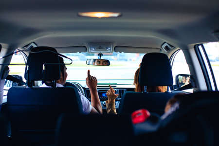 african american family listening a music in car and singingの写真素材