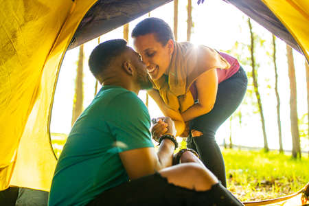 two happy person feeling love to each other having outdoor weekends at picnic in forestの写真素材