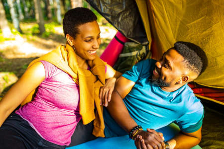 two happy person feeling love to each other having outdoor weekends at picnic in forestの写真素材