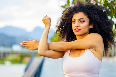 spanish brazil relaxing her hand muscles in outdoorの写真素材