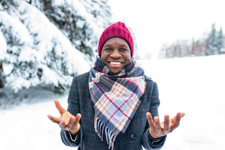 brazilian man posing outdoor in winter forest with snow bacgroundの写真素材
