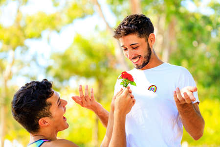 young same sex couple in love outdoors together showing all of feelsの写真素材