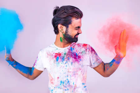Portrait of happy indian person on holi color on white cotton t-shirtの写真素材