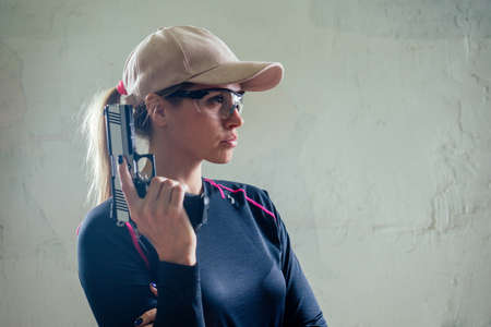 A woman target practicing with a handgun for self defense