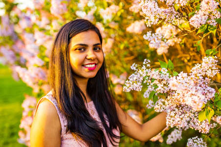 Portrait of beautiful young woman at outdoors