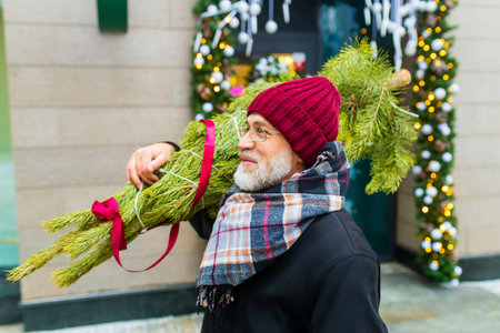 happy mature man in winter christmas market outdoors with cityscape in the background
