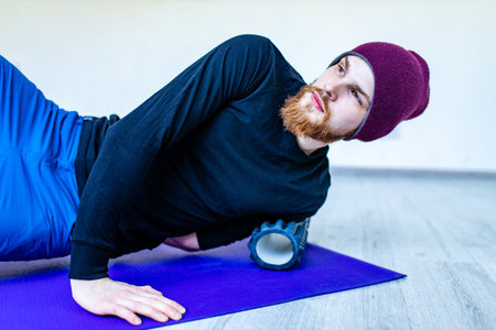 amputees handisport young man doing yoga exercises indoors at home