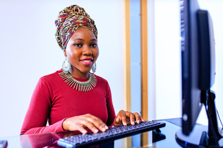african american woman call center operator talking with customer in officeの写真素材