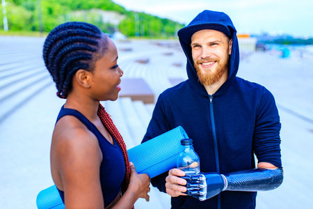 mixed race friends fitness training together outdoors summer morningの写真素材