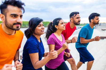 Large group of multi generation people running a race competitionの写真素材