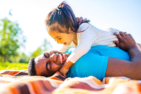 happy family spending time together in sunset summer parkの写真素材