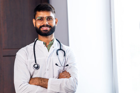 male doctor In uniform with stethoscope arms crosed photoの写真素材