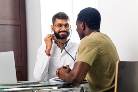doctor and male patient talking at office consultation for further treatmentの写真素材