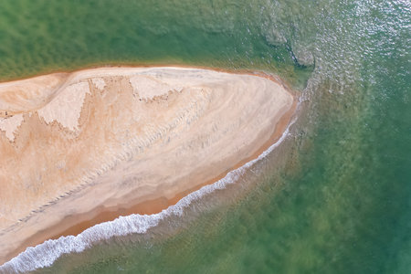 Aerial top view on tropical beach sea under sunlight Drone view in Goa India