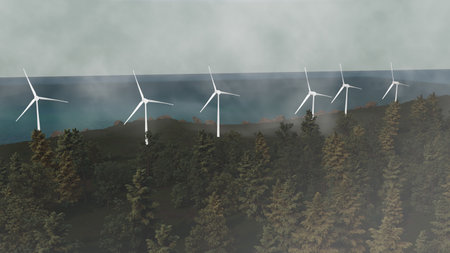 A group of wind turbines are lined up on a hillside next to a body of waterの写真素材