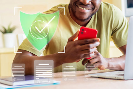 A man is holding a red phone and smiling