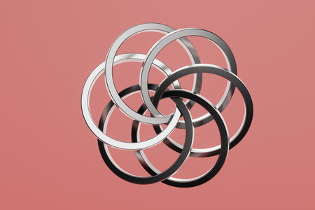 A close up of a silver and black circle with a red backgroundの写真素材