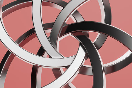 A close up of a silver and black circle with a red background