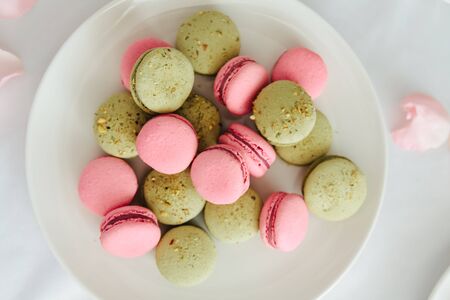 Fresh macarons on white plate close upの写真素材