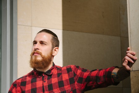 Bearded hipster with piercing in the city outdoorの写真素材