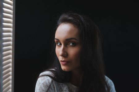 beautiful young women posing in studio on grey background
