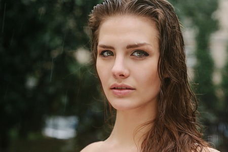 Natural female beauty in summer rain outdoorsの写真素材