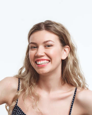 attractive young female in dress isolated on whiteの写真素材