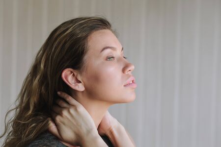 Portrait close up of young beautiful woman in studioの写真素材