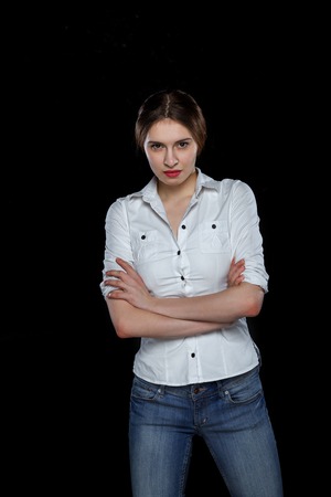Young casual woman isolated over black background studio portrait