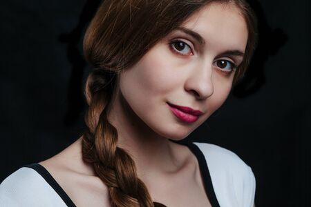 beautiful young women posing in studio on black background