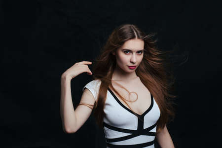 beautiful young women posing in studio on black background