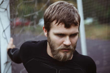 Mature Male Athlete Stretching outdoor doing sportの写真素材