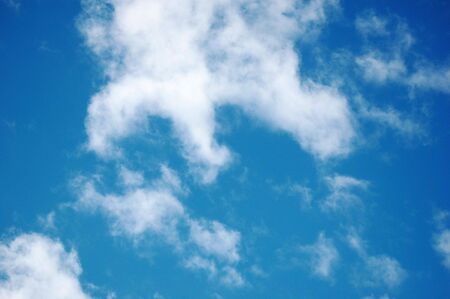 Random white clouds formation and blue skyの写真素材
