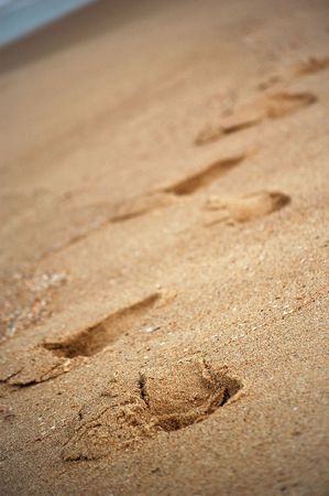 Someone walked in the sand and left footstepsの写真素材