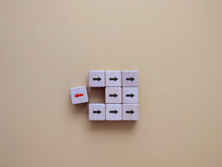 cube with arrow icon. red arrows point in the opposite direction. a different concept of thinking, a...