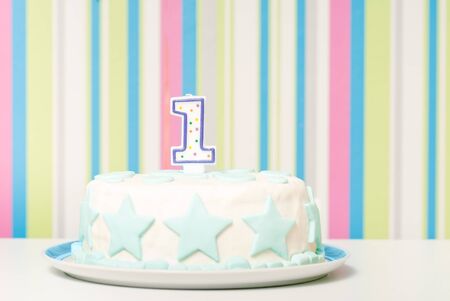 one year birthday cake on the plateの写真素材