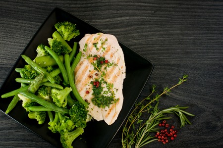 Delicious portion of chicken breast with vegetablesの写真素材