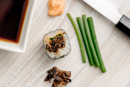 sushi rolls with ingredients on the wooden boardの写真素材