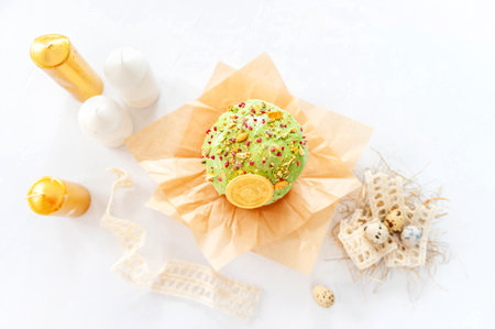 Traditional easter cake or sweet bread, quail eggs over white background.