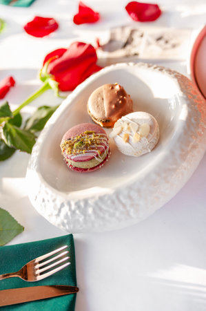 A stack of macarons. Spring composition of macarons with flowers.の写真素材
