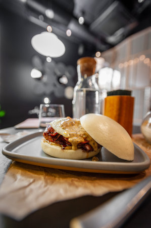 Little Bao delicious chicken burger close up. Best asian burger ever. Not vegan.の写真素材