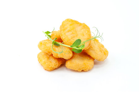 Crispy Chicken Nuggets with Fresh Microgreensの写真素材