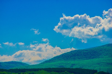 Summer landscape with hills and mountainsの写真素材