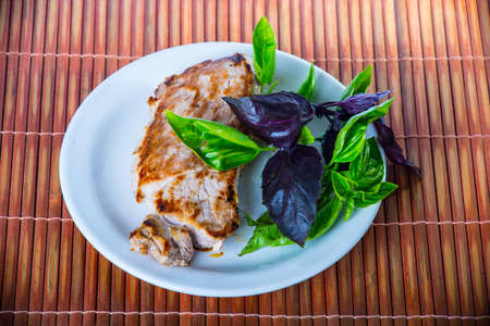 Cooked steak on wooden backgroundの写真素材