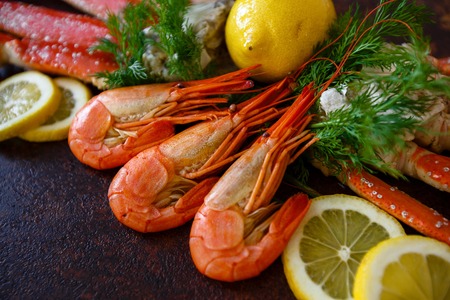 Shrimps with lemon on a background of crab meatの写真素材