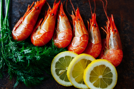 Shrimp close-up with lemon and greensの写真素材