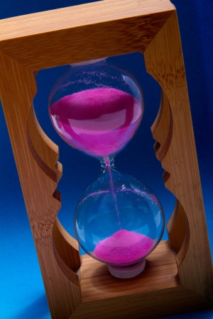 hourglass on turn blue backgroundの写真素材